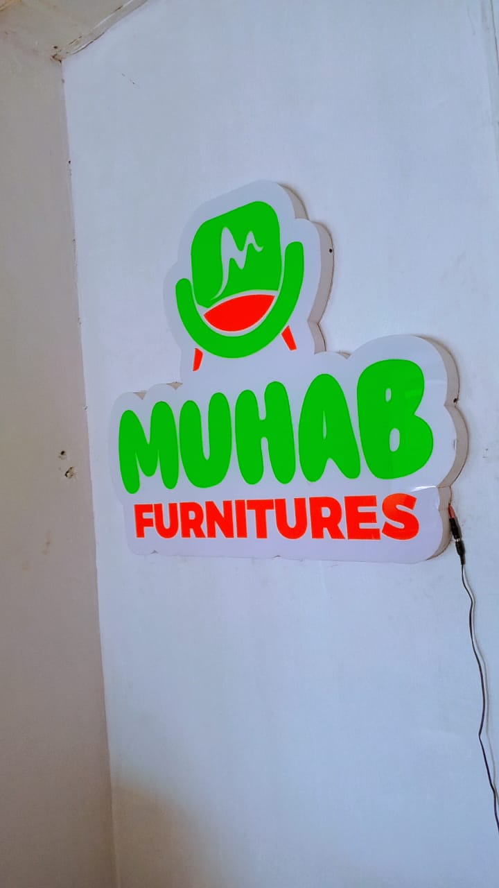 Illuminated MUHAB Furnitures wall mark inside the workspace